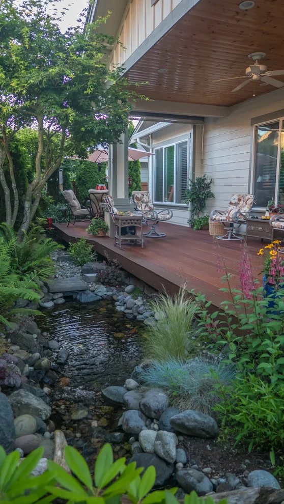 A Compact Backyard by Deck Builders Inc - Photo 12