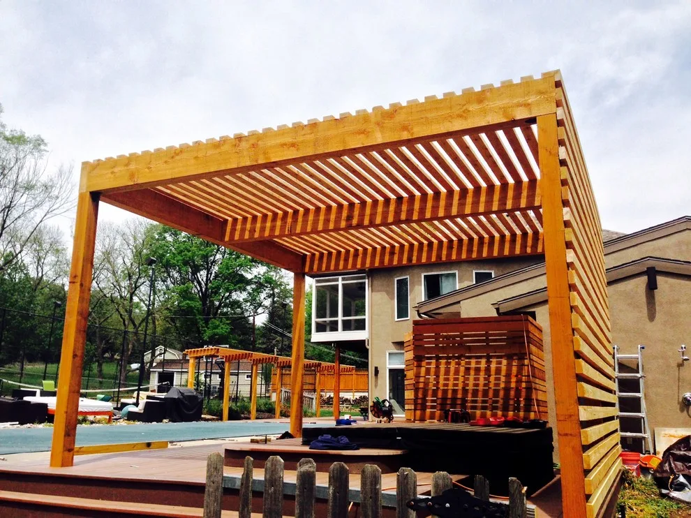 Leawood | Tailored Contemporary Deck Featuring a Hanging Bed and Pergola by Creative Concepts & Design, LLC - Photo 2