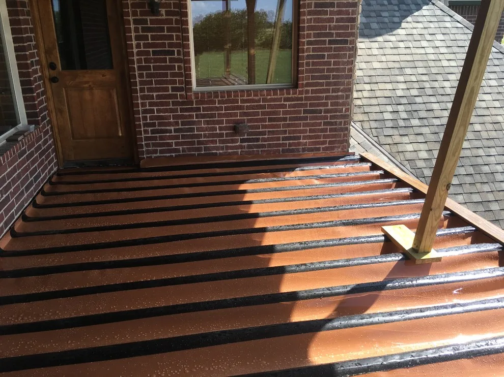 Stunning raised deck featuring Rain Escape for outdoor enjoyment below by Lazo Pro Patios & Decks - Photo 11