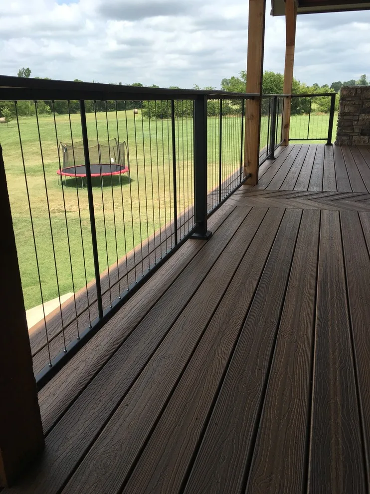 Stunning raised deck featuring Rain Escape for outdoor enjoyment below by Lazo Pro Patios & Decks - Photo 9
