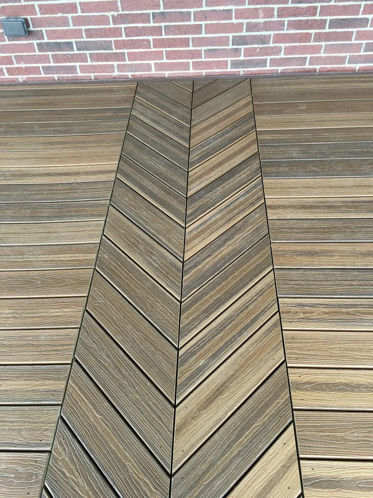 Stunning raised deck featuring Rain Escape for outdoor enjoyment below by Lazo Pro Patios & Decks - Photo 16