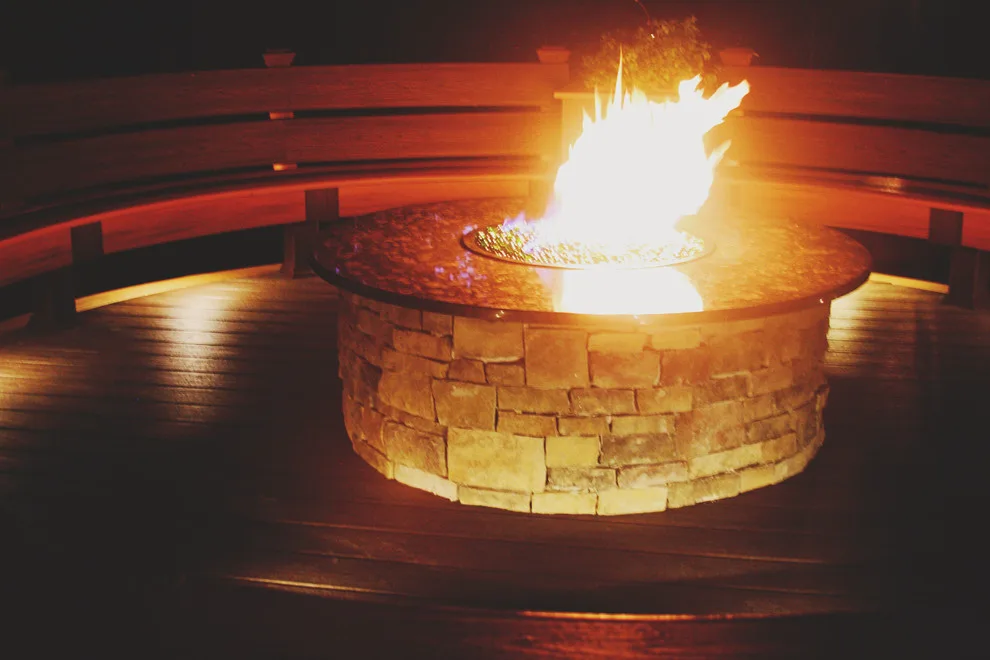 Screened Gazebo with Circular Fire Pit Deck by Miles Deck Construction - Photo 9