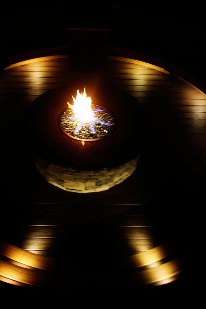 Screened Gazebo with Circular Fire Pit Deck by Miles Deck Construction - Photo 5