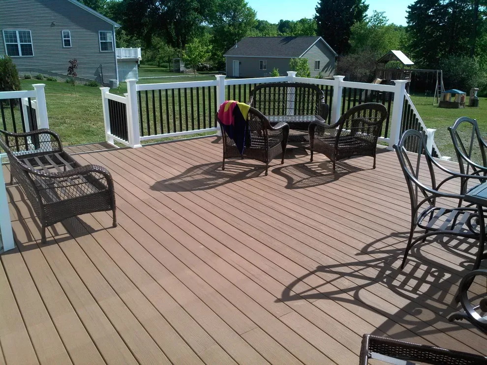 Layered deck with flowing stairs by BKH Development, LLC - Photo 4