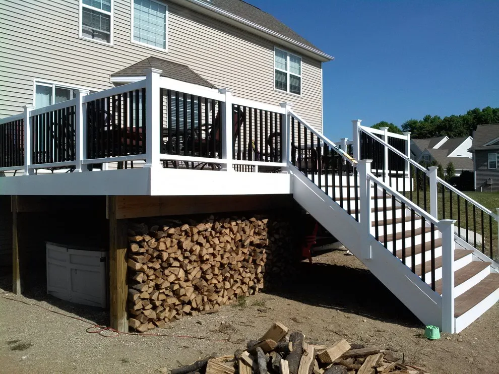Layered deck with flowing stairs by BKH Development, LLC - Photo 5