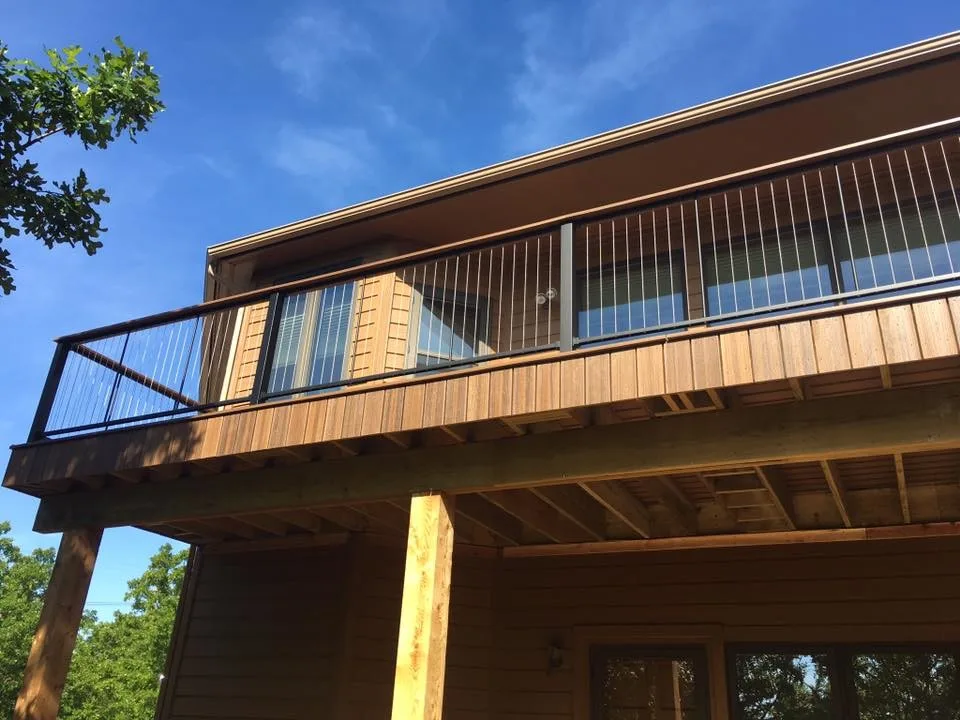 Deck featuring stainless steel cable railing by Lazo Pro Patios & Decks - Photo 7