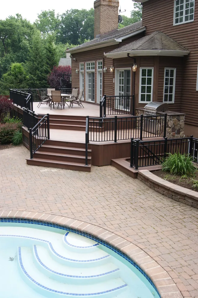 Sophisticated deck design from indoors to poolside by Deck Remodelers.com - Photo 4