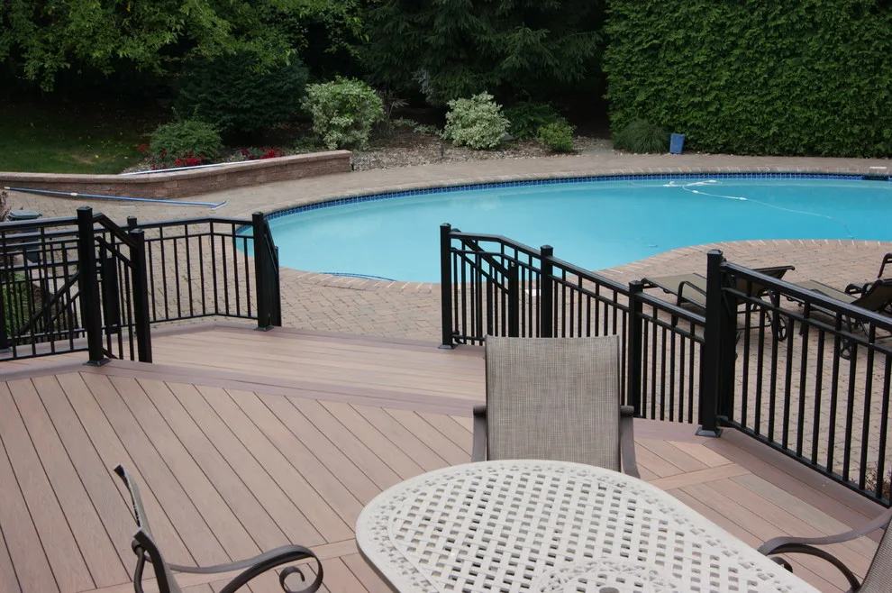 Sophisticated deck design from indoors to poolside by Deck Remodelers.com - Photo 5