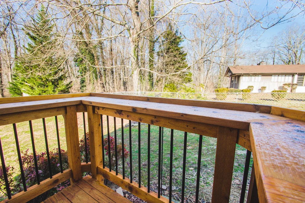 Englewood Cedar screened room with visible beams by Smoky Mountain Deck Builders - Photo 11