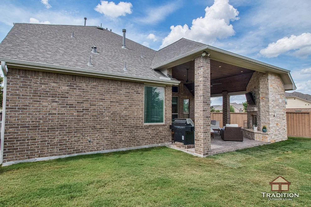 Elevated Patio Featuring Stone Fireplace in Katy, TX by Tradition Outdoor Living - Photo 12