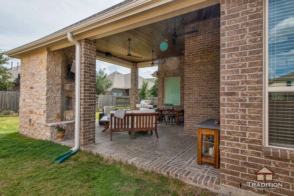 Elevated Patio Featuring Stone Fireplace in Katy, TX by Tradition Outdoor Living - Photo 11