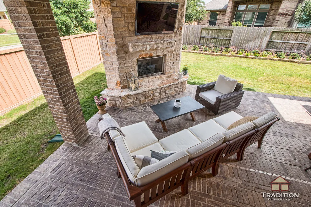 Elevated Patio Featuring Stone Fireplace in Katy, TX by Tradition Outdoor Living - Photo 3