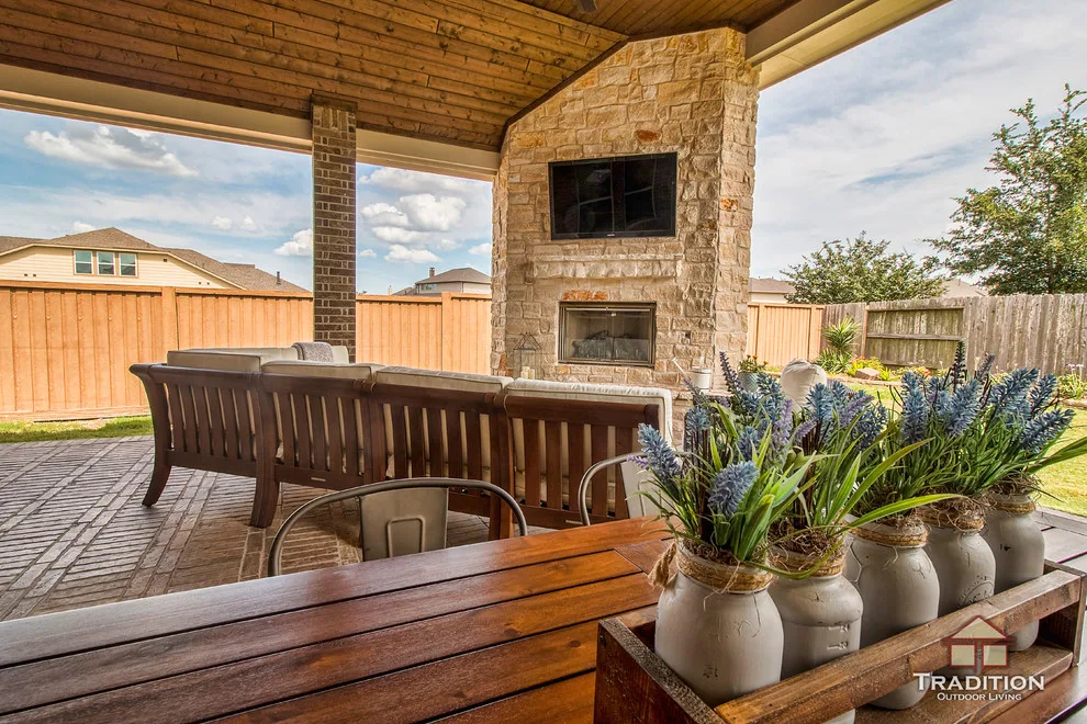 Elevated Patio Featuring Stone Fireplace in Katy, TX by Tradition Outdoor Living - Photo 8