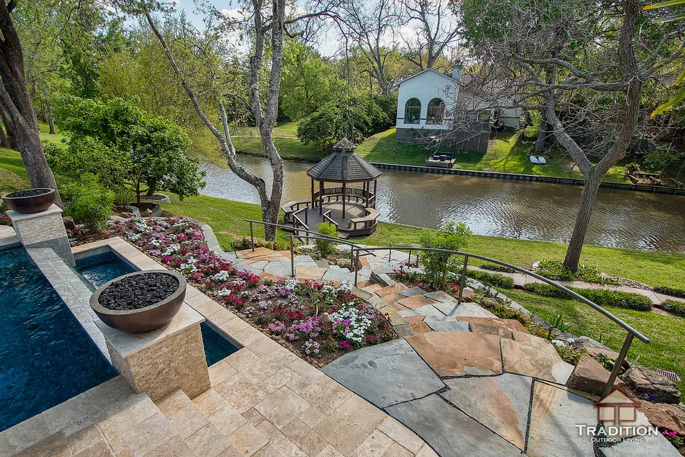 Outdoor Space Featuring Infinity Pool and Stone Steps by Tradition Outdoor Living - Photo 10