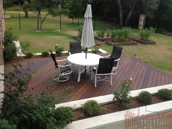 Ipe Wood Deck with Metal Support and Limestone Planters Surrounding Deck by Austin Add-A-Deck - Photo 2