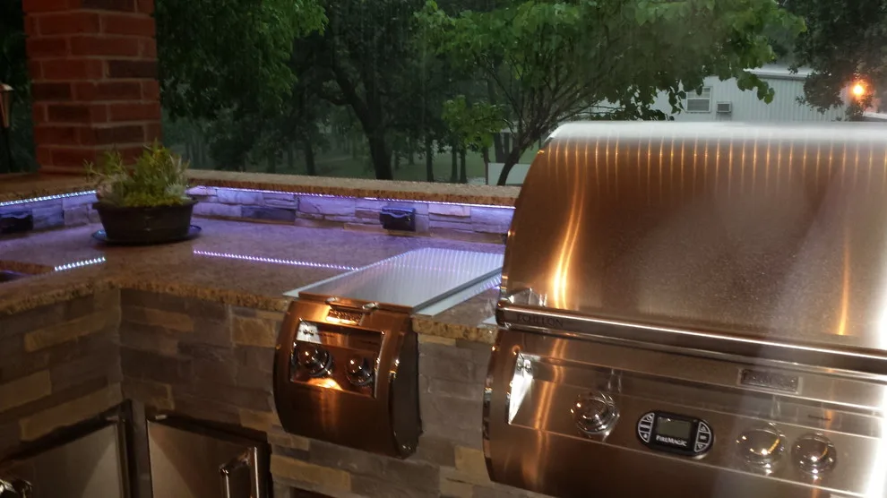 L-Shaped Outdoor Kitchen Featuring Distinctive Lighting by Big Ridge Outdoor Kitchens, LLC - Photo 21