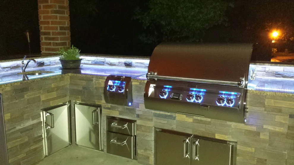 L-Shaped Outdoor Kitchen Featuring Distinctive Lighting by Big Ridge Outdoor Kitchens, LLC - Photo 12