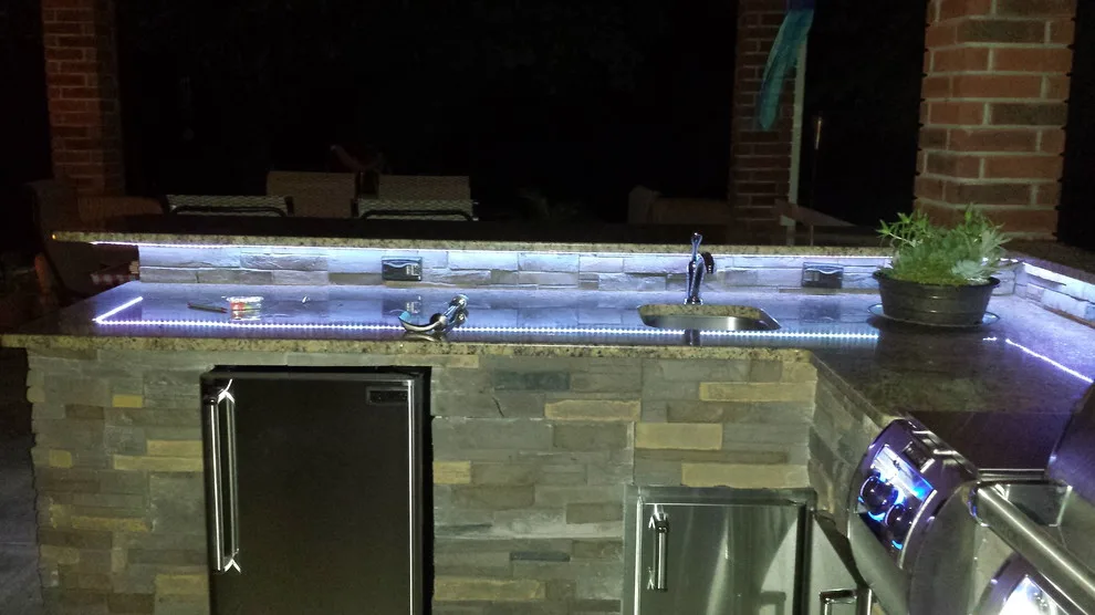 L-Shaped Outdoor Kitchen Featuring Distinctive Lighting by Big Ridge Outdoor Kitchens, LLC - Photo 20