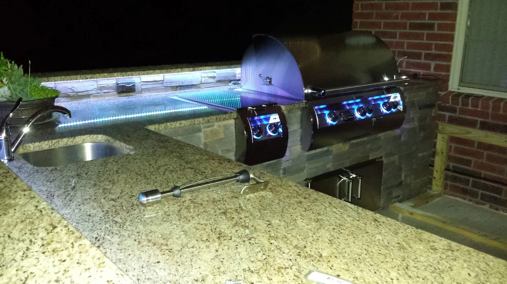 L-Shaped Outdoor Kitchen Featuring Distinctive Lighting by Big Ridge Outdoor Kitchens, LLC - Photo 17