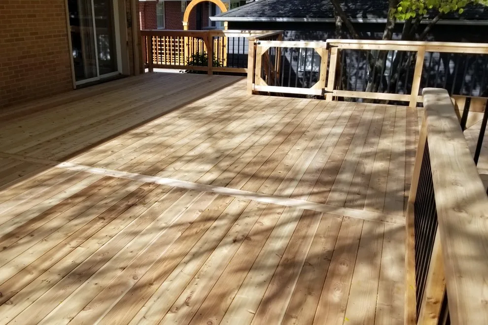 Spacious Cedar Deck on Brick Home by Deck & Drive Solutions - Photo 3