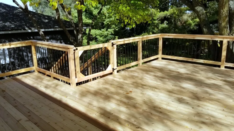 Spacious Cedar Deck on Brick Home by Deck & Drive Solutions - Photo 6