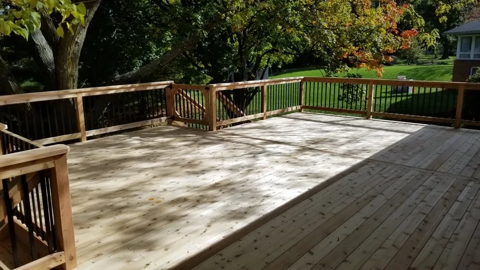 Spacious Cedar Deck on Brick Home by Deck & Drive Solutions - Photo 7