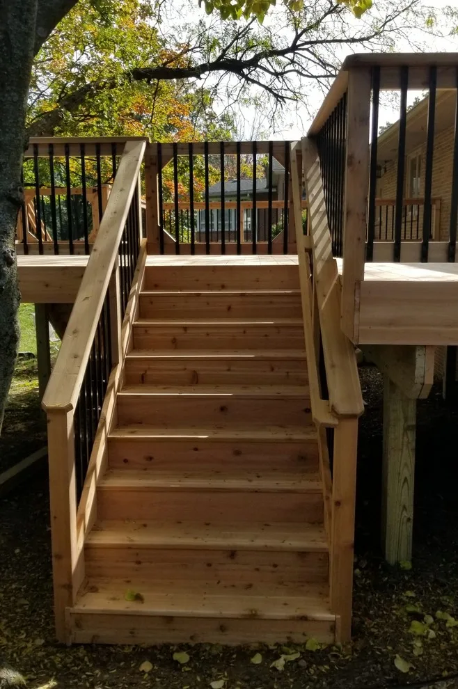 Spacious Cedar Deck on Brick Home by Deck & Drive Solutions - Photo 5