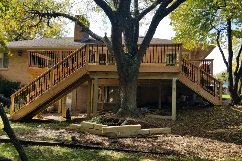 Spacious Cedar Deck on Brick Home by Deck & Drive Solutions - Photo 9