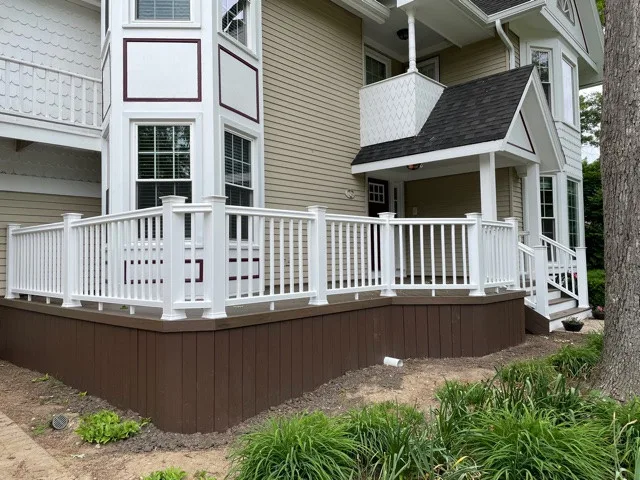 Mocha TimberTech Deck with White Radiance Railings in Wheaton, IL by Archadeck Of Chicagoland - Photo 2
