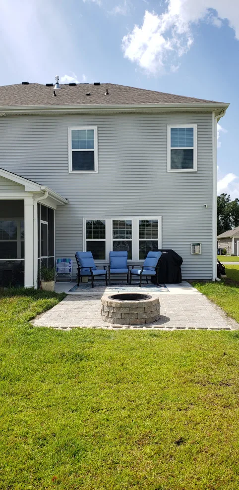 landscaped patio with fire pit installation by Southern Shores Hardscape/Paver Design - Photo 5