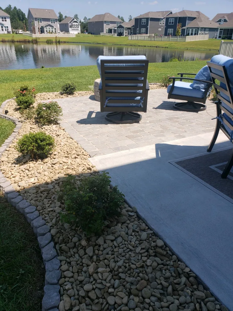 landscaped patio with fire pit installation by Southern Shores Hardscape/Paver Design - Photo 2