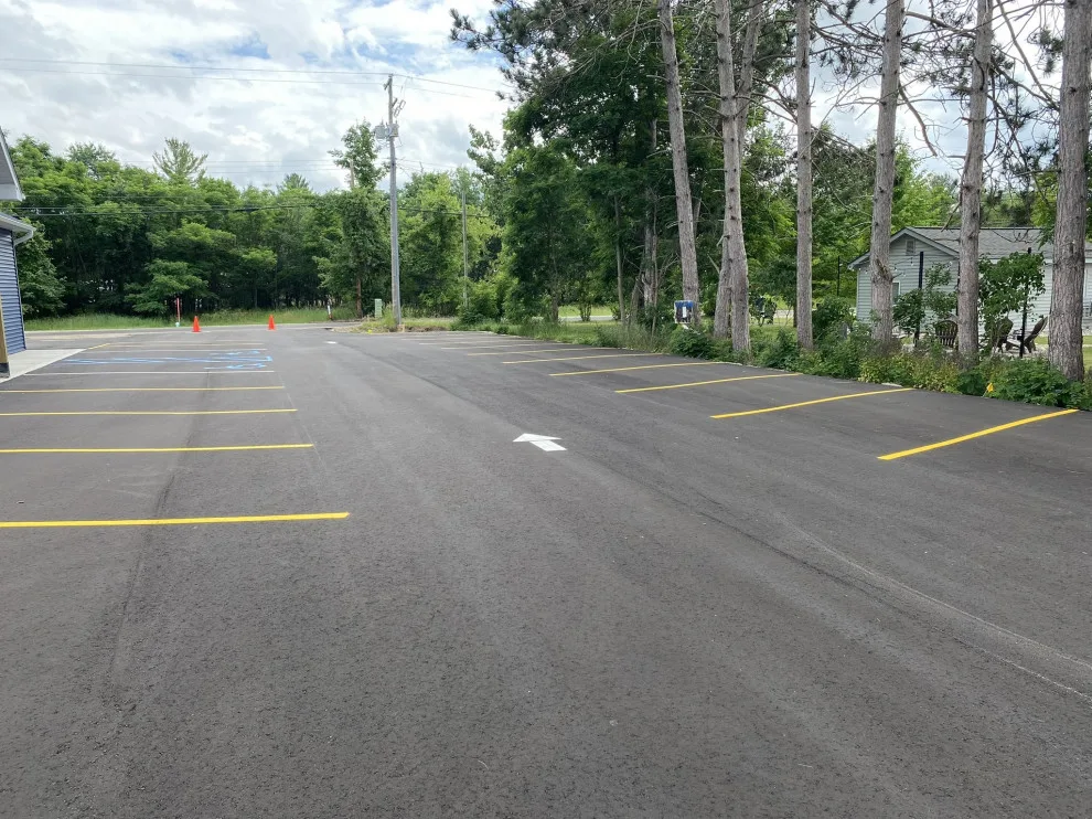 Parking Space Marking by Grand Traverse Sealcoating & Striping - Photo 11