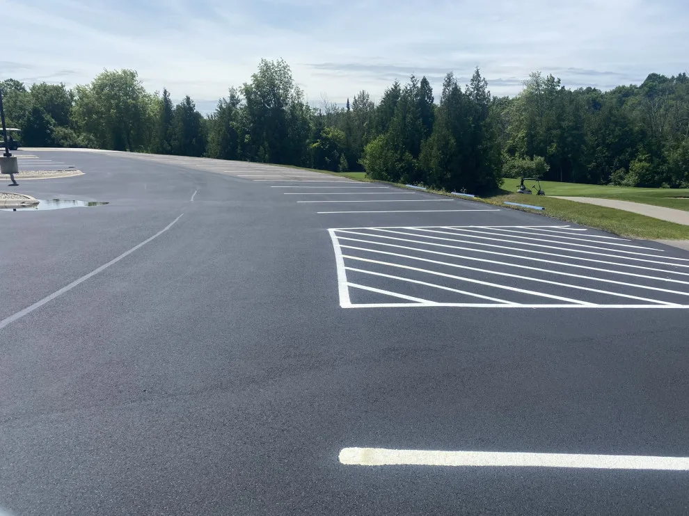 Parking Space Marking by Grand Traverse Sealcoating & Striping - Photo 16