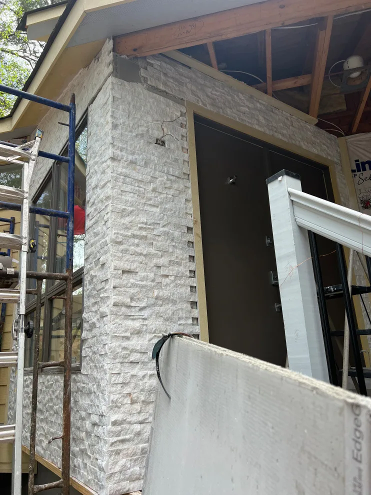 Contemporary Stone Facade by Gonzalez Construction Co - Photo 6