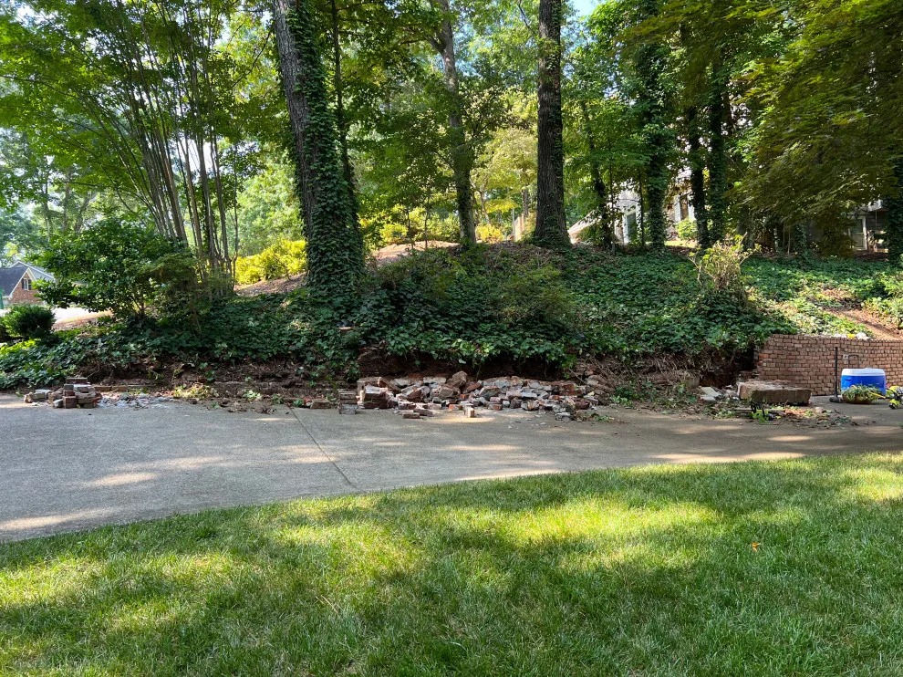 Brick Retaining Wall Restoration by Gonzalez Construction Co - Photo 5