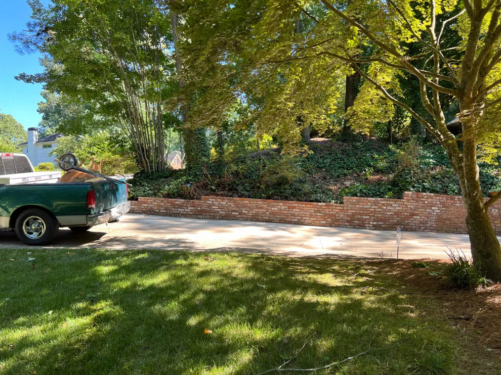 Brick Retaining Wall Restoration by Gonzalez Construction Co - Photo 2