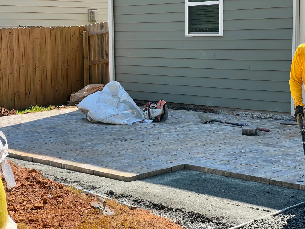 Sierra pavers installation along with firepit and seating wall by Gonzalez Construction Co - Photo 6