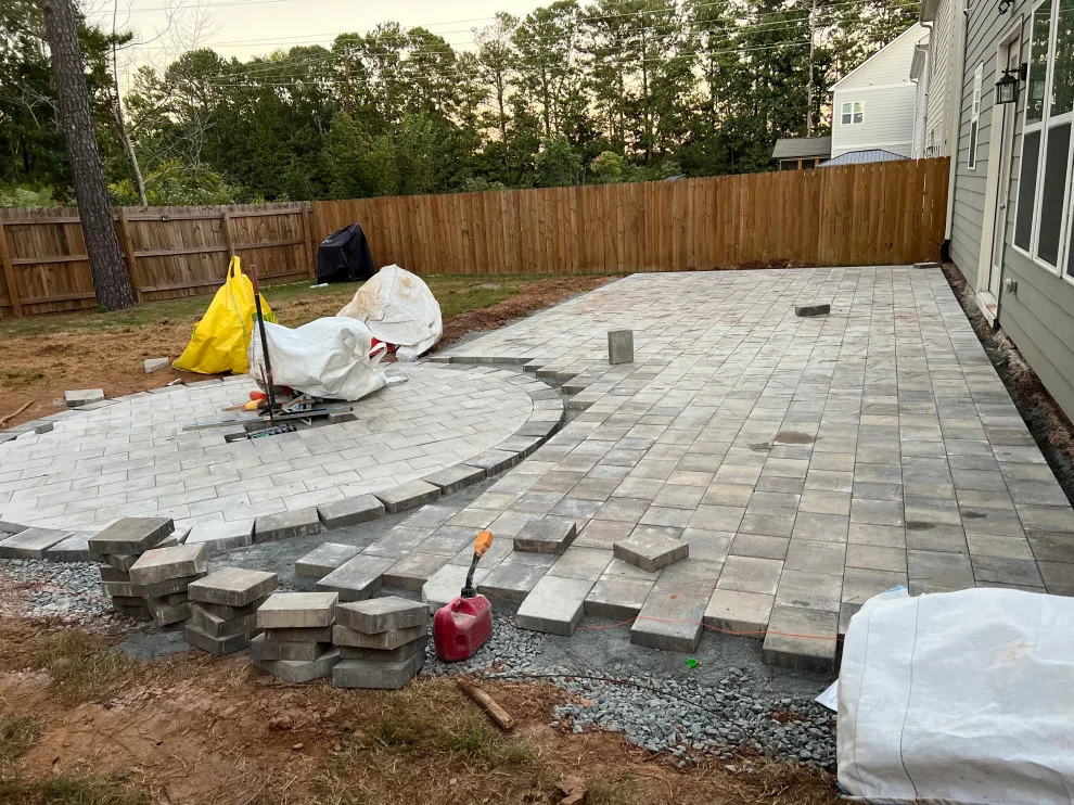 Sierra pavers installation along with firepit and seating wall by Gonzalez Construction Co - Photo 11