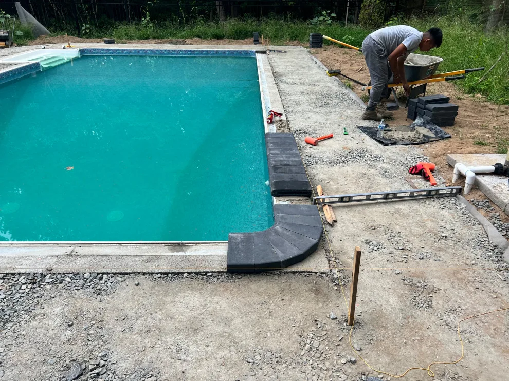 Paver installation around the swimming pool by Five Star Contractors - Photo 10