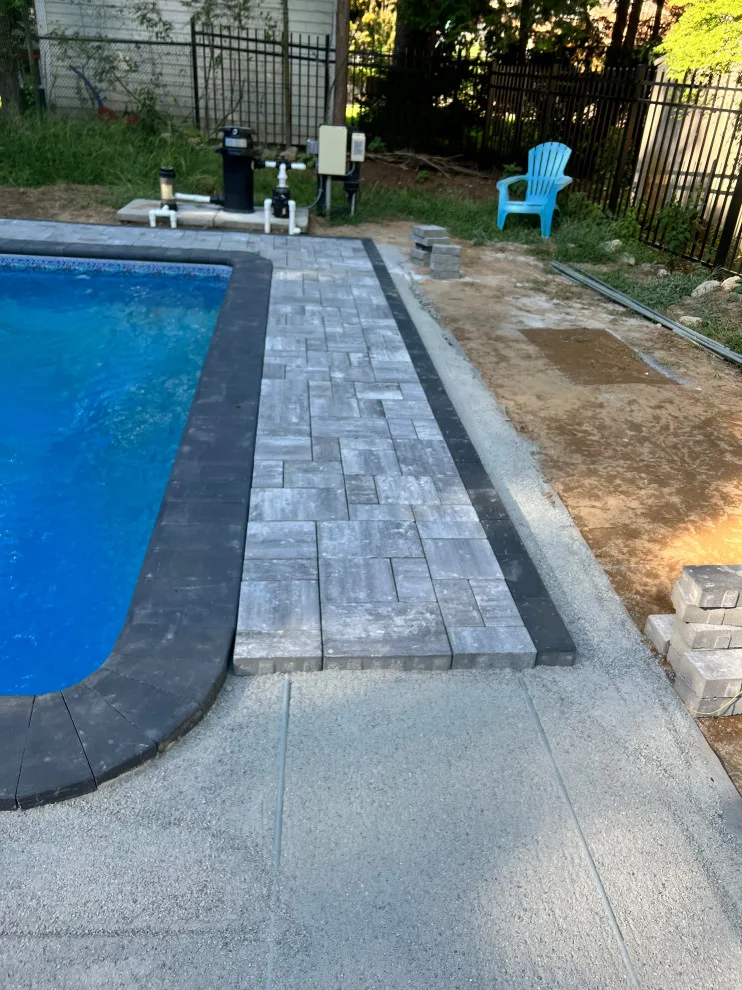 Paver installation around the swimming pool by Five Star Contractors - Photo 12