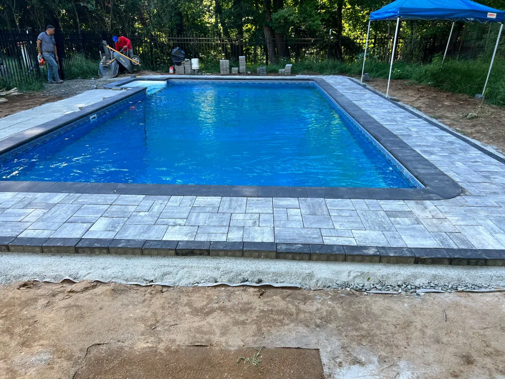 Paver installation around the swimming pool by Five Star Contractors - Photo 7