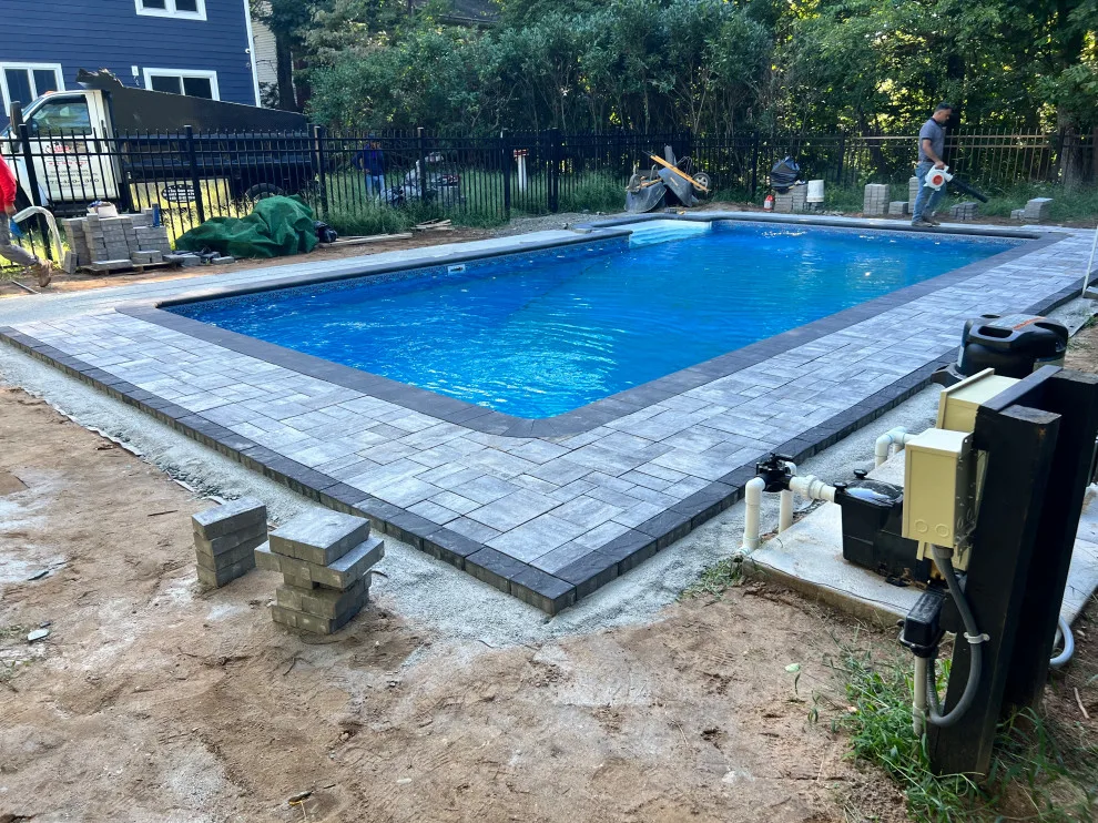 Paver installation around the swimming pool by Five Star Contractors - Photo 13