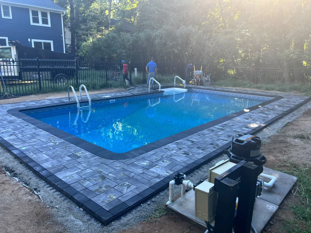 Paver installation around the swimming pool by Five Star Contractors - Photo 11
