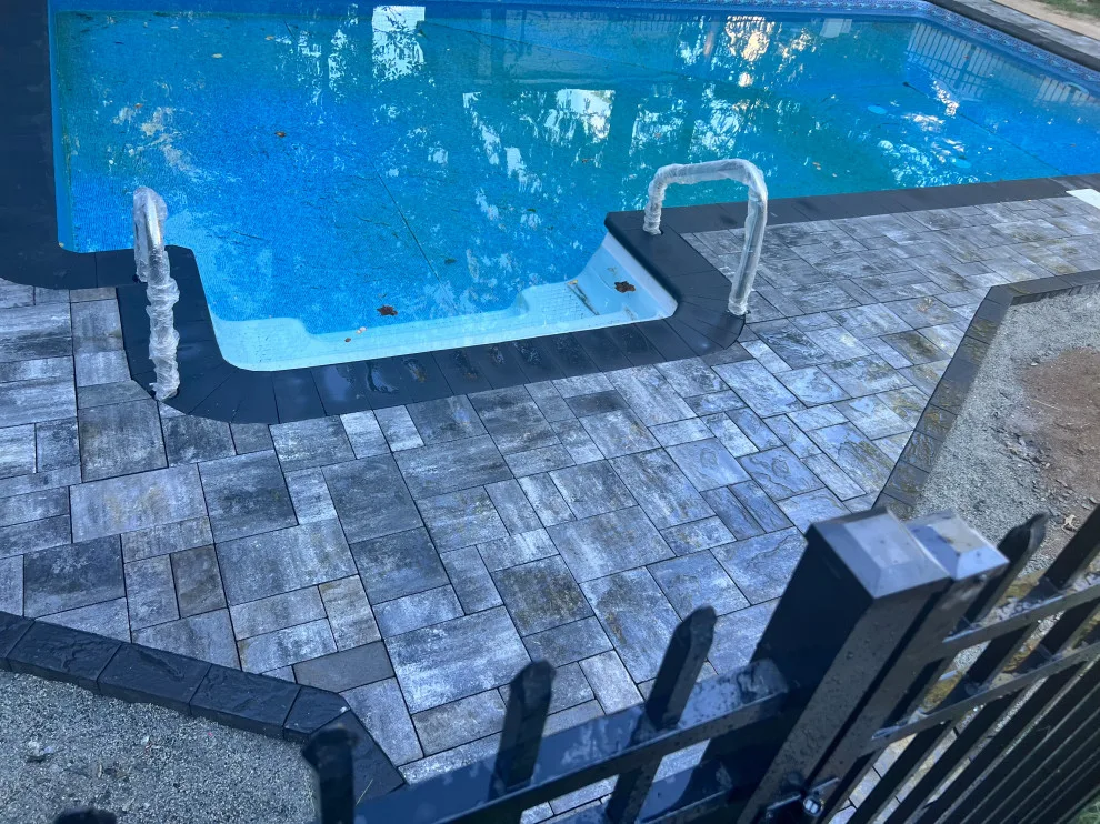 Paver installation around the swimming pool by Five Star Contractors - Photo 9