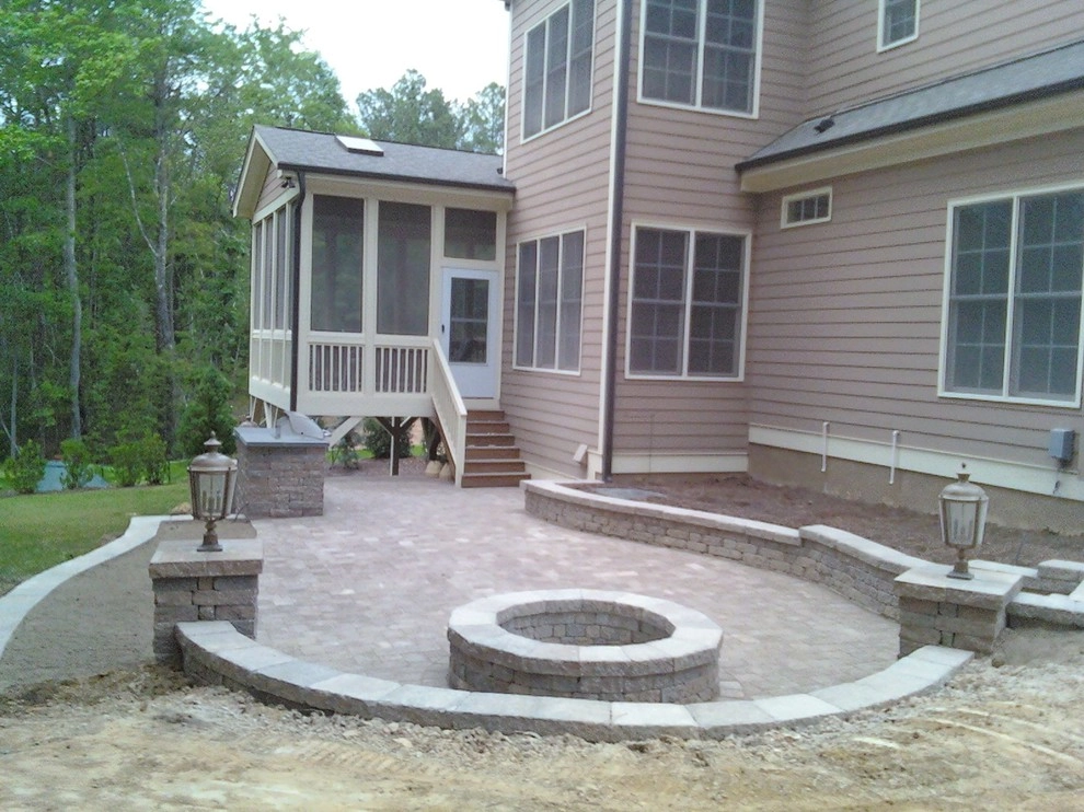 Custom Patio with Sitting Wall and Firepit by Sutton Outdoor, LLC - Photo 2