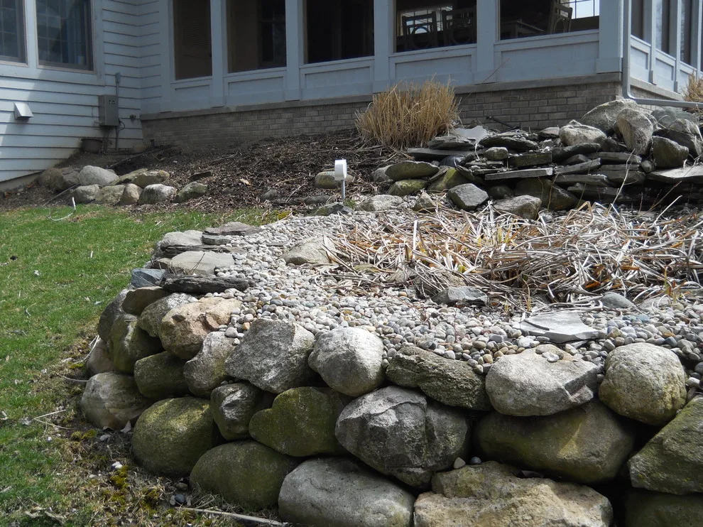 Expanded patio with stone wall by Twin Oaks Landscape, Inc. - Photo 5