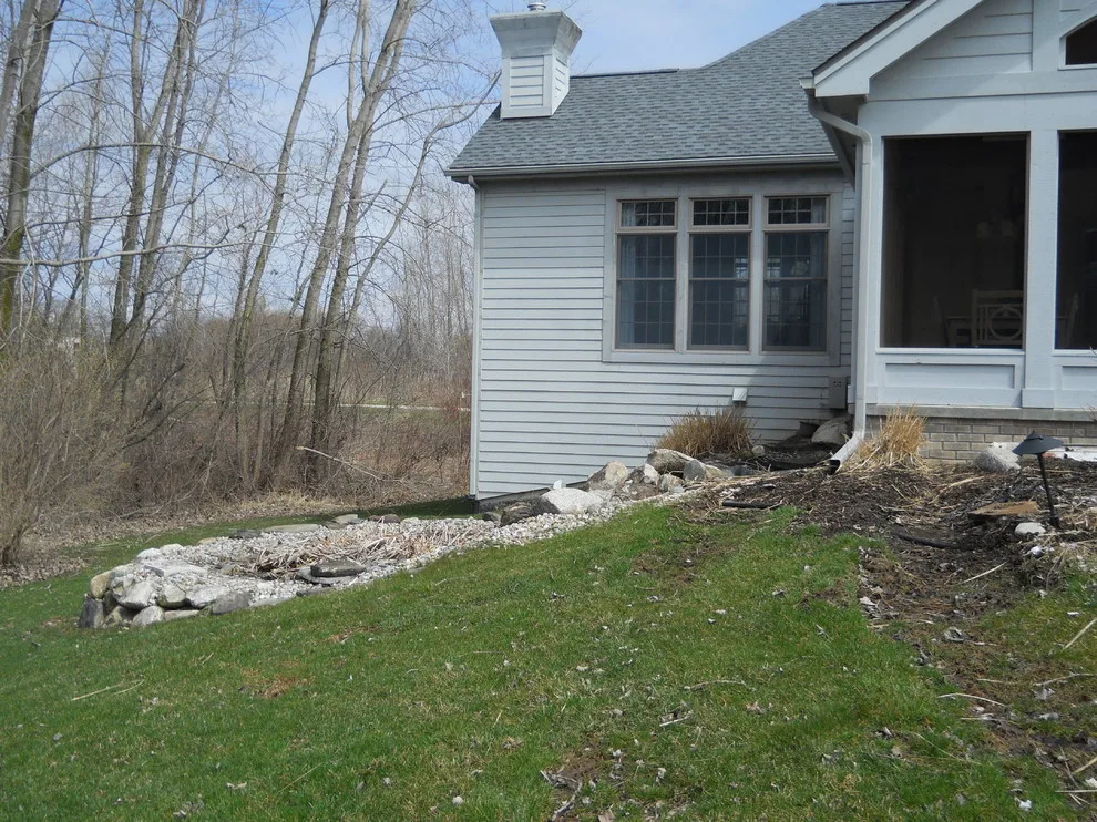 Expanded patio with stone wall by Twin Oaks Landscape, Inc. - Photo 7