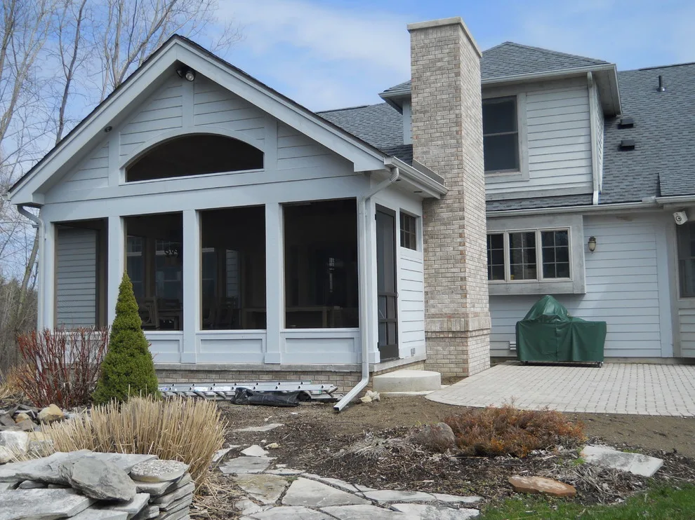 Expanded patio with stone wall by Twin Oaks Landscape, Inc. - Photo 8