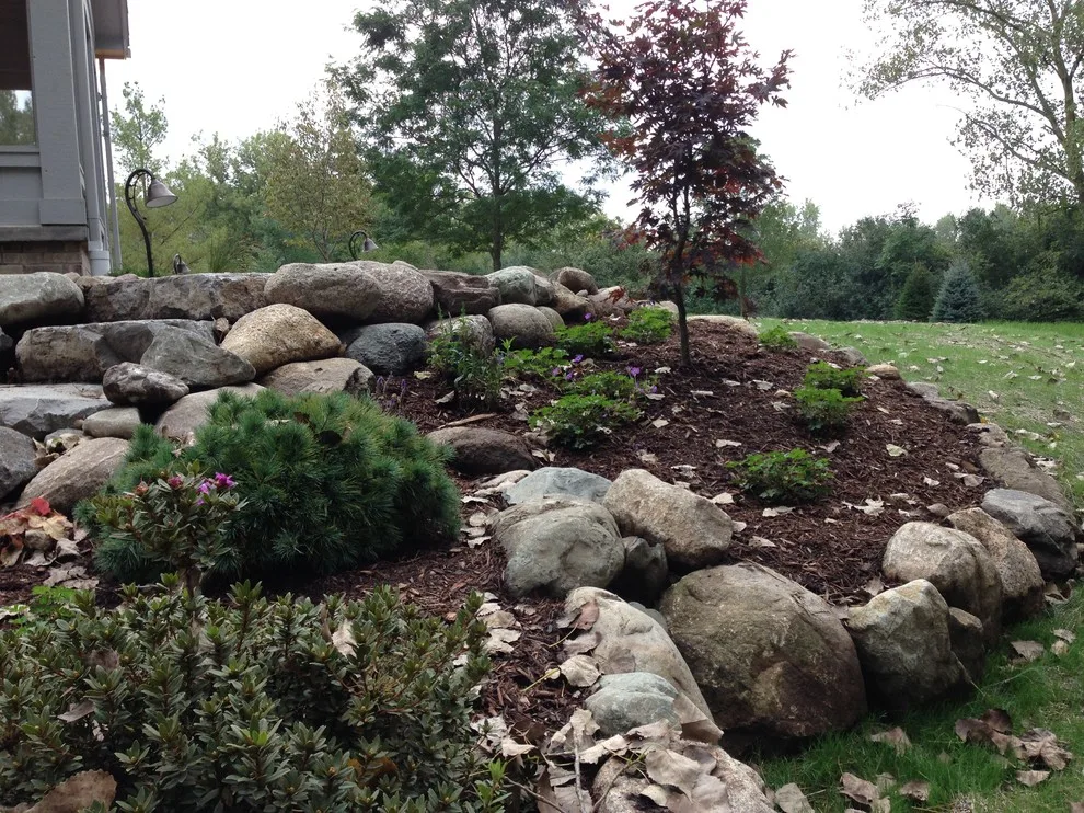 Expanded patio with stone wall by Twin Oaks Landscape, Inc. - Photo 3