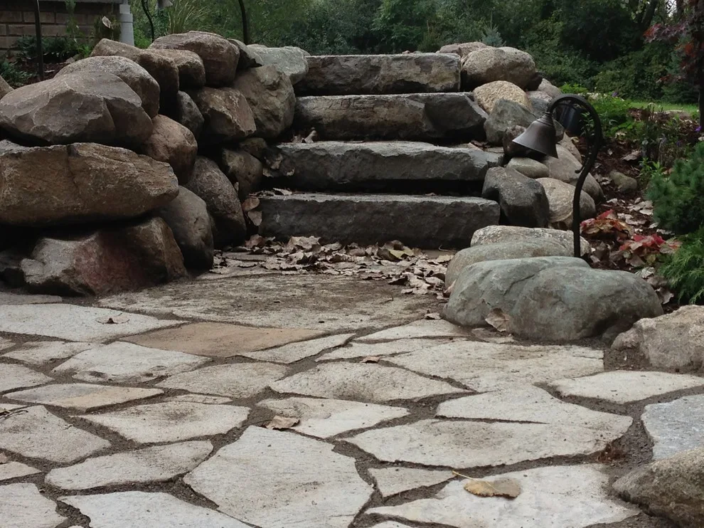 Expanded patio with stone wall by Twin Oaks Landscape, Inc. - Photo 4
